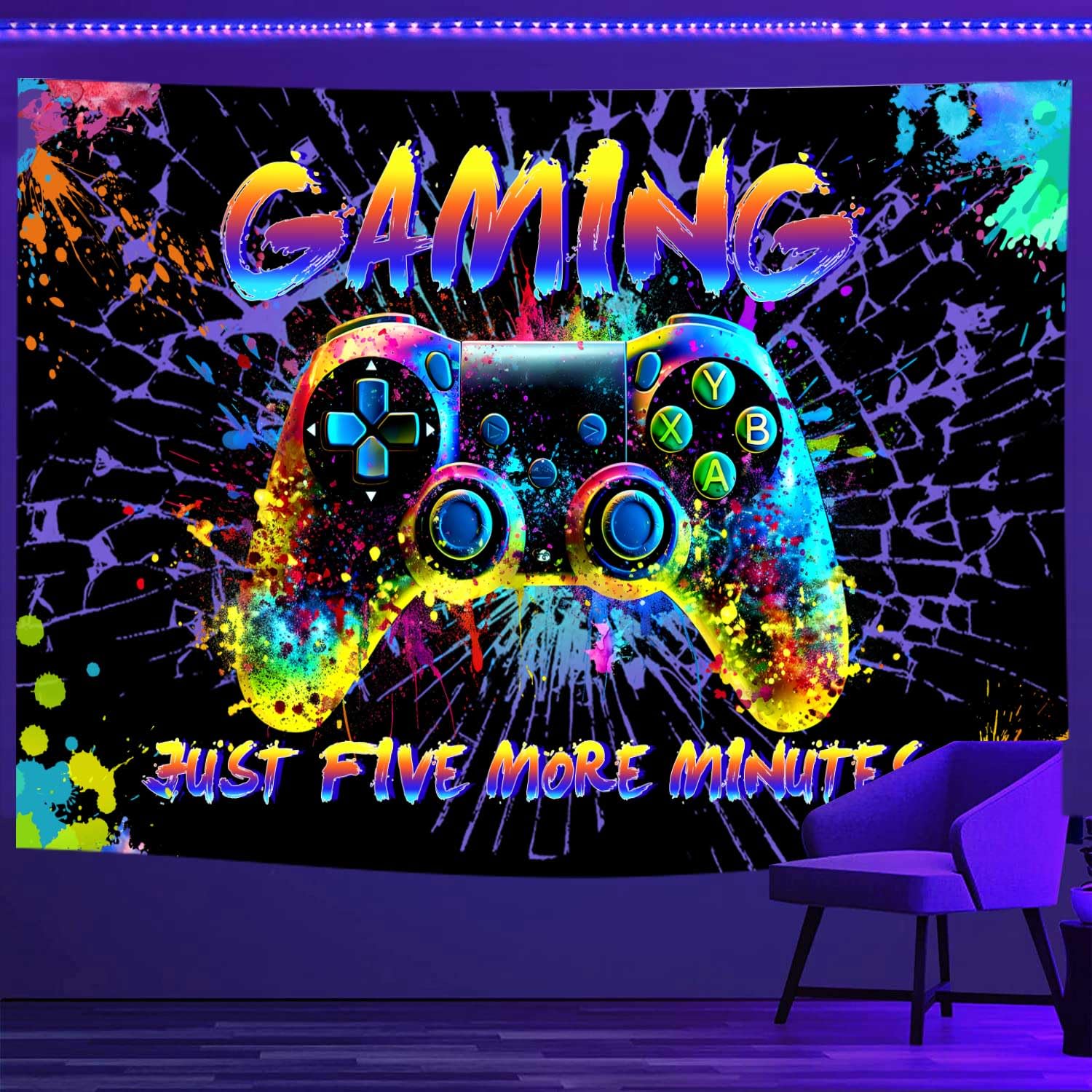 A neon-colored gaming tapestry with a large video game controller in the center, graffiti-style "GAMING" text, and "Just Five More Minutes" written at the bottom, glowing under blacklight.