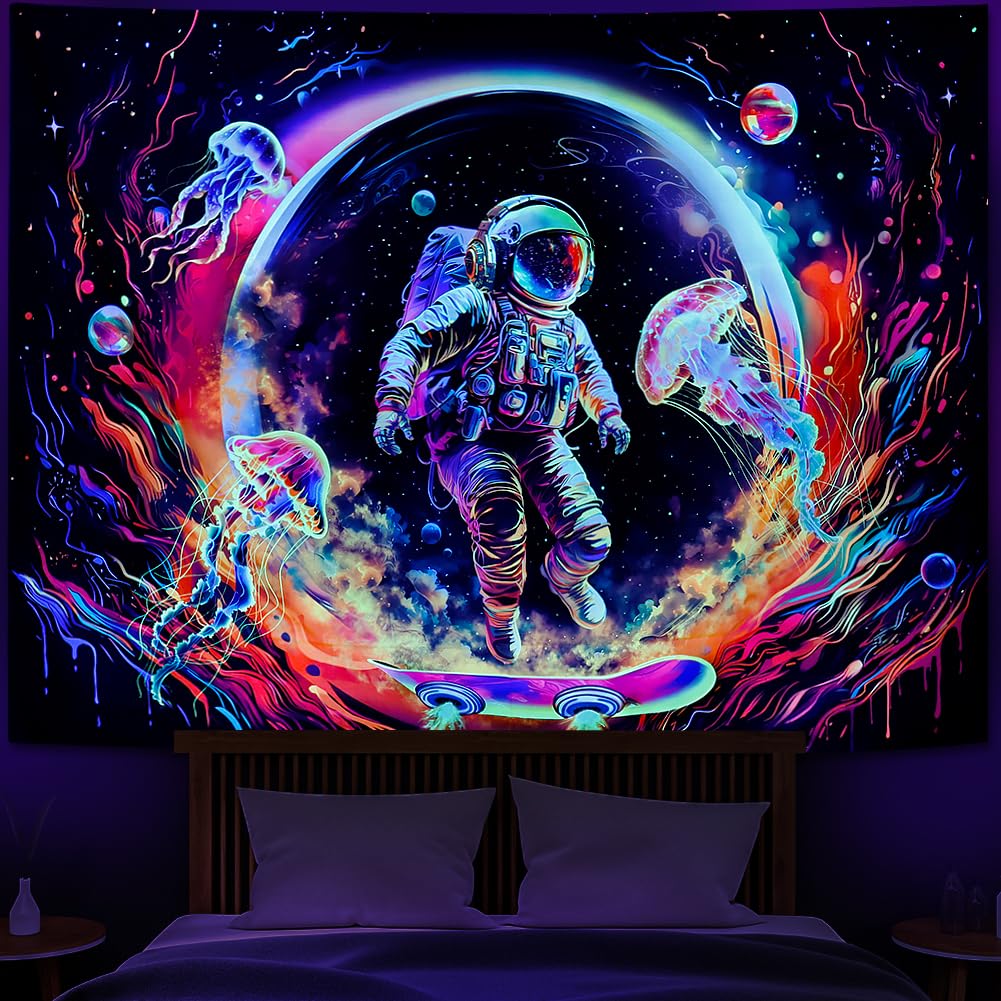 A vibrant UV-reactive blacklight tapestry featuring an astronaut on a skateboard surrounded by glowing neon jellyfish and a colorful ringed planet in a deep space setting.